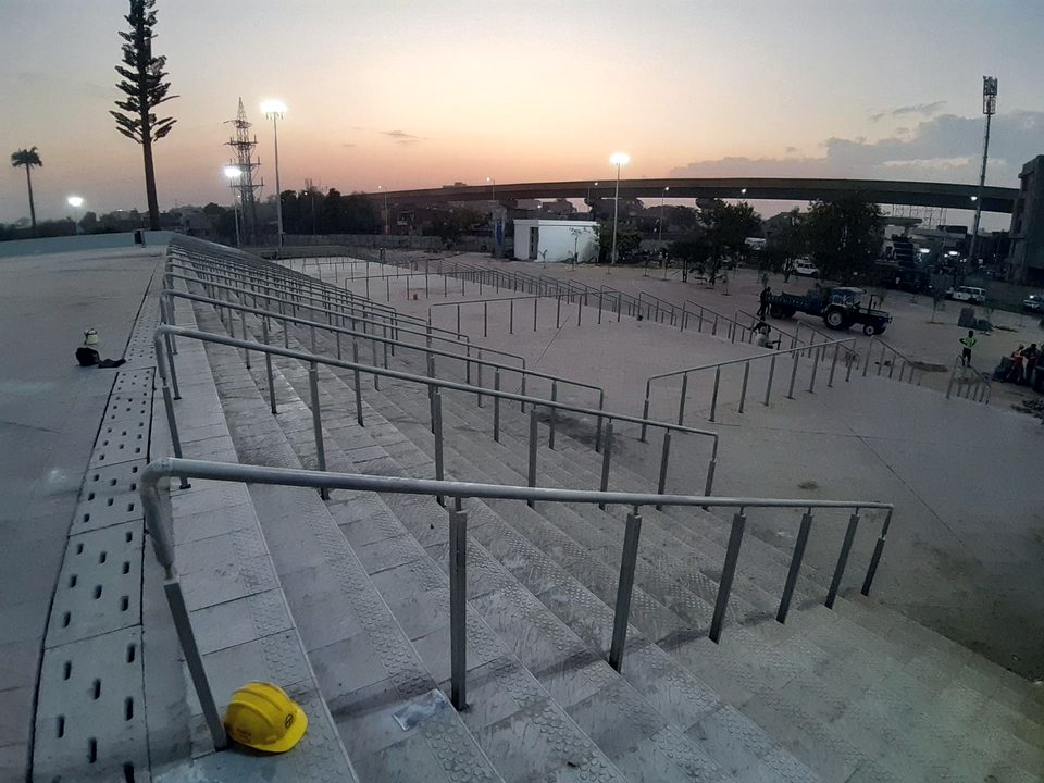 Mild steel railings to external steps, coated against weather and specified for public circulation.