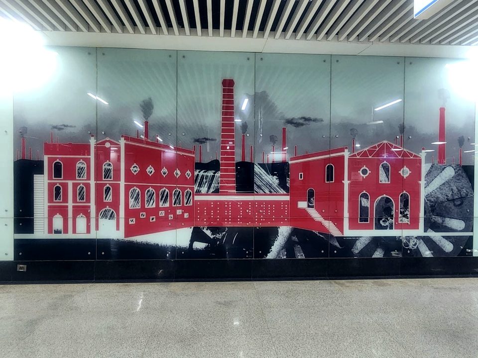 Printed glass mural panel depicting industrial heritage in red and monochrome